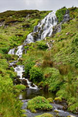 Fototapeta na wymiar Brides Veil Falls waterfall on Highway A855 to Loch Leathan at The Storr on Isle of Skye Scottish Highlands Inner Hebrides Scotland UK