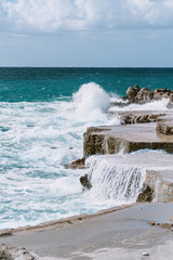 Rocky coast about which the waves break.