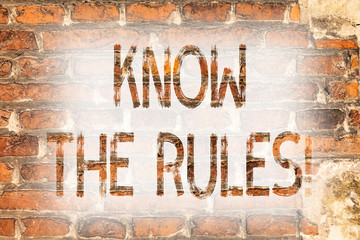 Writing note showing Know The Rules. Business photo showcasing Be aware of the Laws Regulations Protocols Procedures Brick Wall art like Graffiti motivational call written on the wall