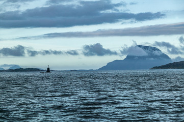 Obraz premium sea and landscape with steep mountains and dramatic cloud sky in the fords of middle Norway, Scandinavia
