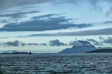 sea and landscape with steep mountains and dramatic cloud sky in the  fords of middle Norway, Scandinavia