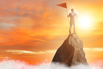 Businessman at the top of mountain 