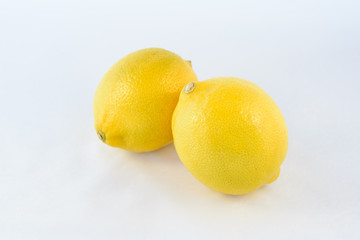 Two lemon fruits isolated on white background