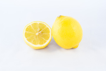 Lemon and a half isolated on white background