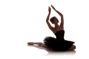 woman ballerina in black pack posing on white background photo made in the style of 