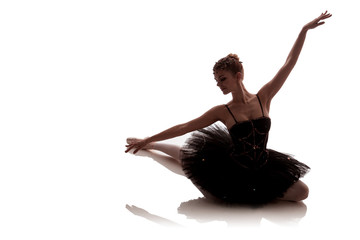woman ballerina in black pack posing on white background photo made in the style of 