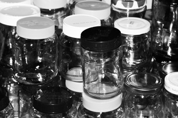 Pile of different glass jars stacked on top of each other