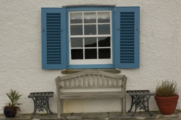 Fototapeta na wymiar Shuttered window on cottage in Cornwall