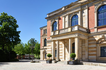 opera house of Richard Wagner in Bayreuth,Germany, named Festspielhaus, with a public building, that contains toilets, post office and a kiosk, shot from a public place