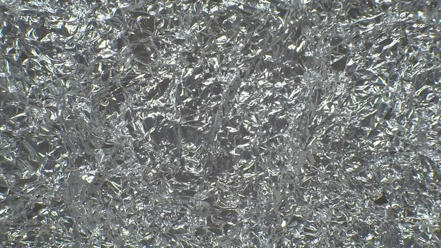 Texture of crumpled aluminum foil in motion.Camera movement from left to right. 1920X1080 Full Hd.