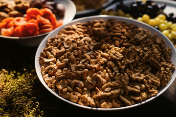 Food snack tray holiday buffet table served by different canape, sandwiches, snacks, nuts, peanuts ready for eating in restaurant