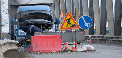 Road repair on the bridge in winter