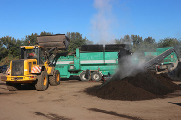 Wheel loader working in a composting facility for biowaste, green waste and sewage sludge. The...
