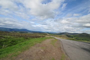 Fototapeta na wymiar straight road in scotlands highlands