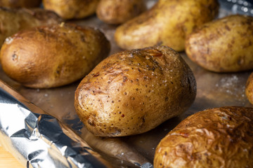 Oven baked potatoes on a foiled pan