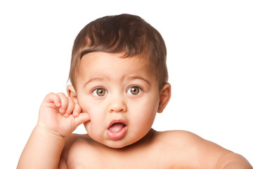 Cute baby infant with big green eyes thumb on cheek on white