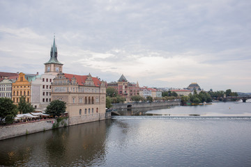 Fototapeta na wymiar Old street and river of the city of Prague in the Czech Republic