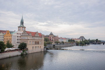 Old street and river of the city of Prague in the Czech Republic