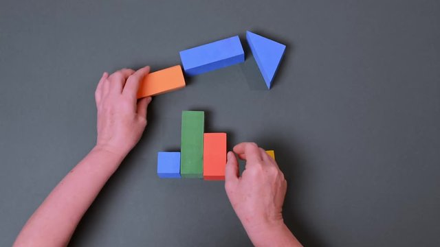 Woman's hand Building toy house