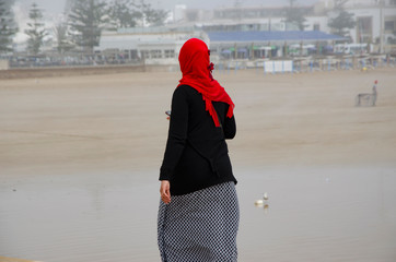 Arab woman at the beach of Essaouira, Morocco