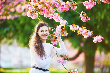 Woman enjoying cherry blossom season in Paris, France