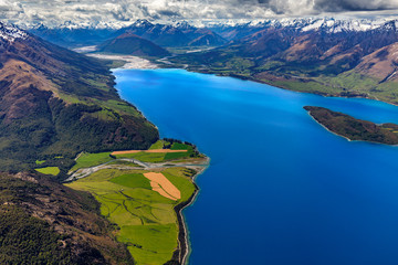 New Zealand, South Island, Otago region. The nothern end of Lake Wakatipu surrounded by Southern Alps, Greenstone River on the left, Pigeon Island on the right, Glenorchy settlement in the background
