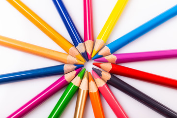 Naklejka premium Colour pencils in circle on white background