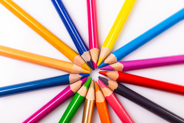 Naklejka premium Colour pencils in circle on white background