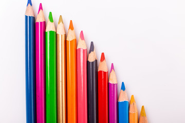Fototapeta premium Many colorful pens in several arrangements isolated on white background