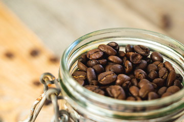 Top view of a glass jar filled with coffee beans