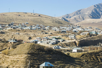 low-rise private houses sprawled on the slopes of the mountains on the outskirts of Dushanbe