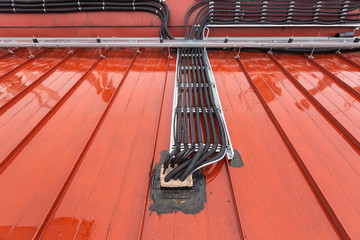 Cable tray outside with telecommunications cables, optic fiber, power cables and transmitter data...