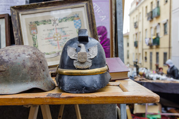 Old fashioned military helmet for sale in a street flea market