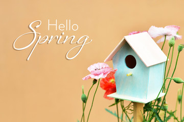 Hello Spring text, bird house and flowers