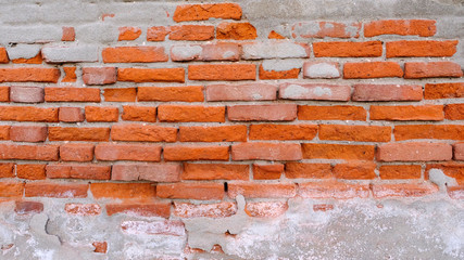 Old brick wall with cement dressing texture for background