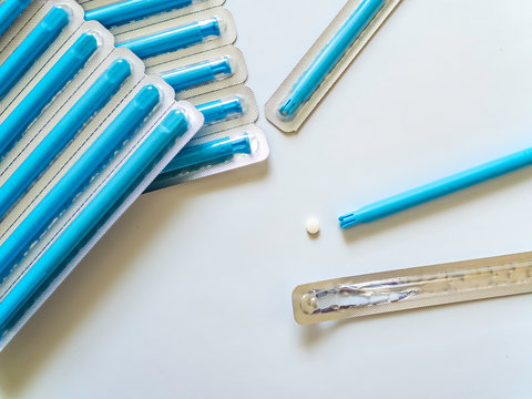 Vaginal hormone compensation medicine with applicator on a white background with copy space. Women's health concept