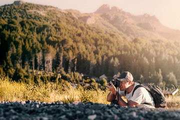 photographer taking a picture in the mountains learning lesson teach class photography course info...