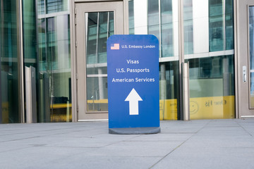 Sign directing visitors to the consular services at the newly opened US Embassy in Nine Elms, London