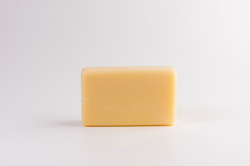 piece of beige soap isolated on a white background