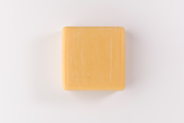 piece of beige soap isolated on a white background, top view