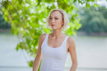 Blonde girl with natural look on the green background