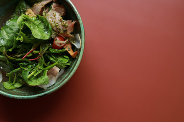 Food in the corner, coral color background