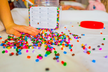 plenty of toy beads in child hands