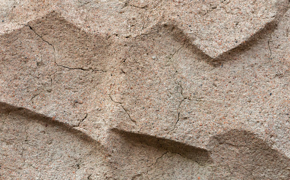 Ribbed concrete wall closeup photo. Cement surface with fluted texture.