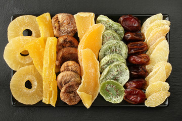 Candied fruit pieces of mango, papaya, kiwi, pineapple; dried figs, dates; pieces of candied ginger...