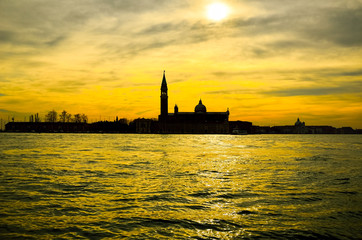 Naklejka premium Romantic view of historical ancient church tower in the water