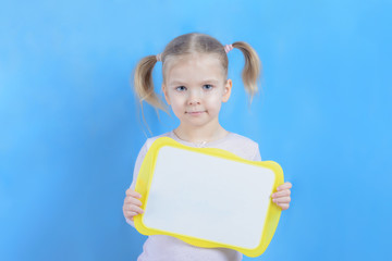A copy of the space on the plate that is held in the hands of a little girl. A cute child with...