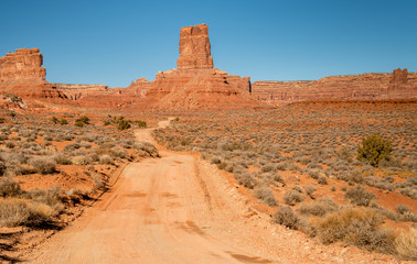 Dirt road leads to the infamous Valley of the Gods in Utah