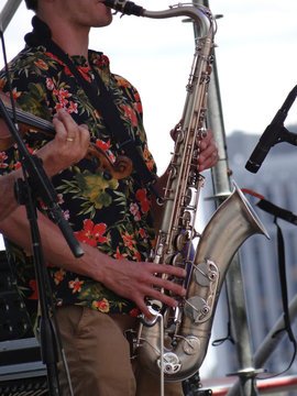 Zydeco Cajun saxophone player performing