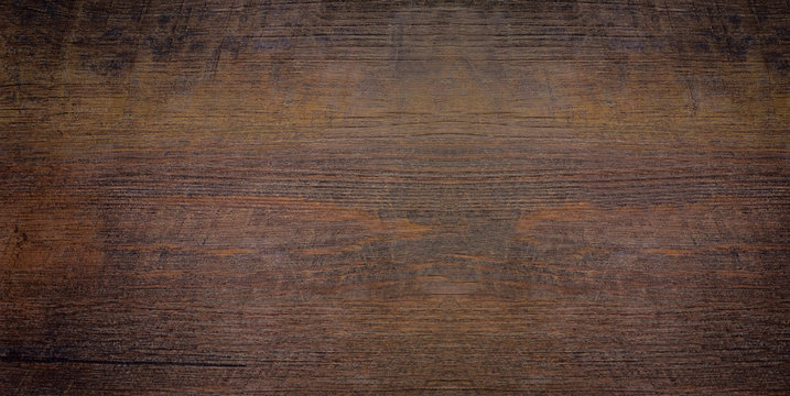Wood texture abstract background, dark rough plank for backdrop. Old brown wooden table with crack. Surface of vintage wood board or laminate with dark natural color and pattern.
